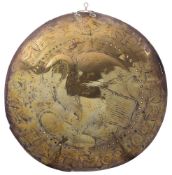 An 17th Century brass warming pan lid: depicting a stylised eagle with a band of text 'The Earl of