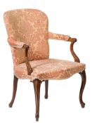 A George III mahogany open armchair in the French Heppplewhite taste: with an upholstered stuff