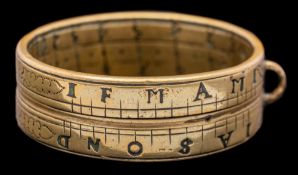 An early 18th Century brass pocket ring sundial: with adjustable central marker,