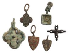 Five late Medieval horse harness pendants: includes two shield-shaped examples,