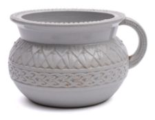 A Belleek (First Period) satirical chamberpot: of typical form the exterior with moulded decoration,