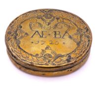 A George III brass tobacco box: of oval form,