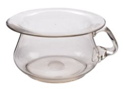 Two glass chamber pots: comprising a cranberry glass example with clear ribbed handle and applied