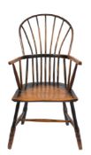 An early 19th Century Cornish ash and birch stick back Windsor elbow chair: the shaped solid birch