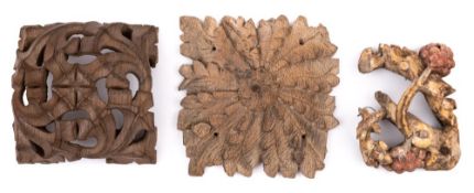 A reproduction carved oak square boss: of foliate design with central flowerhead, 21cm.