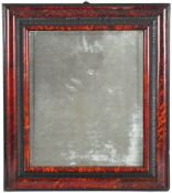 An early 18th Century scarlet tortoiseshell and ebonised framed wall mirror: with rectangular