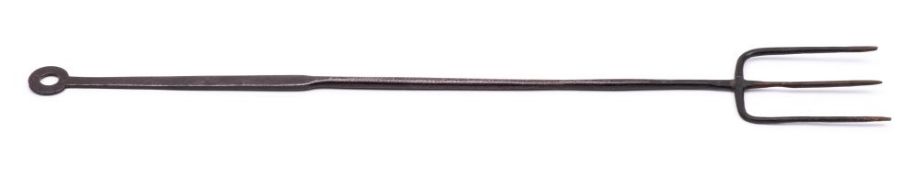 An early 19th Century wrought iron flesh fork: the handle brass inlaid 'A Cooper, 1816', 45cm long.