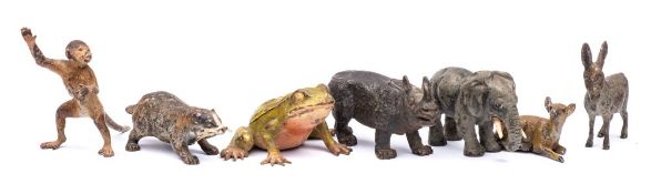 A group of six Austrian cold painted bronze animals: comprising an elephant, rhinoceros, badger,