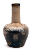 A Martin Brothers saltglazed stoneware vase: of mallet shaped form incised with a long-eared owl