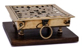 An 18th Century Dutch square brass plate-warmer: with pierced foliate and engraved decoration,