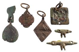 Six late Medieval horse harness pendants: includes T-shaped, lozenge, square and oval examples.