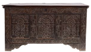 A late 17th Century carved oak rectangular coffer:, with a plain hinged moulded top,