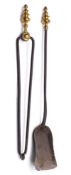 An 18th Century iron fire shovel: and pair of matching tongs with cast brass knopped handles.
