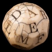 An 18th Century English marine ivory 'teetotum' gambling ball: the twenty-six sides carved and