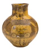 A North Devon pottery documentary harvest jug: of typical bellied form with raised neck and ribbed