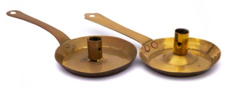 Two late 17th/early18th Century Dutch brass 'frying pan' chambersticks: the circular dishes with