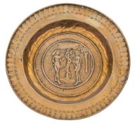 A 16th/early 17th Century Nuremburg brass alms dish: the central panel depicting Adam and Eve
