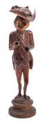 A 19th Century Swiss or Austrian novelty nutcracker: carved as a gentleman wearing a tail coat,