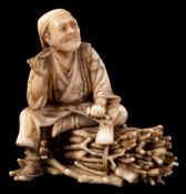 A Japanese ivory okimono,