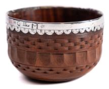 A late 17th/early 18th Century lignum vitae and silver mounted tumbler cup: with engine turned
