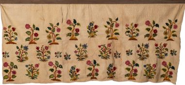 An 18th Century Continental embroidered skirt: with single pocket and three bands of flowering