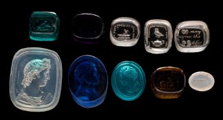 A group of ten coloured and clear glass intaglio seals: including a Roman head and shoulders bust