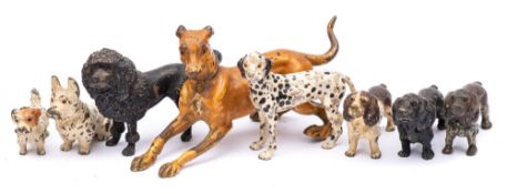 A group of eight Austrian cold painted models of dogs: including a greyhound, dalmation,