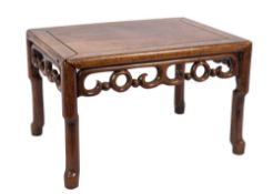 A Chinese Hua Li wood rectangular urn table:, with a pierced scroll apron,