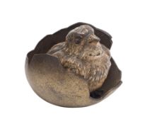An Austrian bronze cold painted model of a chick emerging from a shell: stamped Geschutz, 50cm.