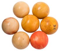Seven assorted ivory billiard balls: (7).