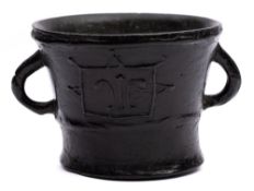 A late Medieval bronze mortar: of tapering form with two loop handles,