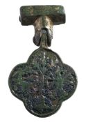 A late Medieval gilt metal horse harness pendant: decorated with a hunter and stag.