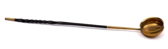 A mid 18th Century gilded brass toddy ladle: with twisted horn handle. 45cm long.