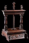 A fine James I dated oak press: the top carved with bands of arcading and guilloche surmounted with