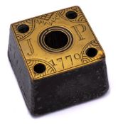 A George III square tapering lead inkpot: with engraved brass top initialled JP, 1770, 5.5cm wide.