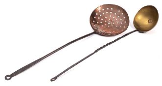A late 18th/early 19th Century brass ladle: with twisted wrought iron handle and a copper skimmer