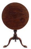 A mid 18th Century mahogany circular tea table: with a snap top,