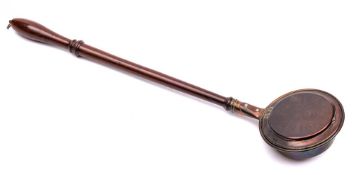 An early 19th Century small copper warming pan: with turned mahogany handle,