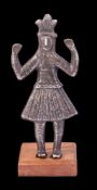 A South American silver Talisman figure: wearing traditional feathered headdress and feather skirt,