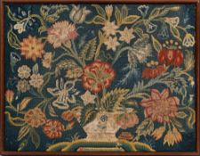 An 18th Century gros-point needlwork panel: worked with a large vase of flowers and foliage,