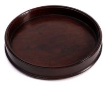 A Georgian turned mahogany small wine coaster: with moulded rim, 10.5cm. diameter.