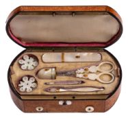 An early 19th Century burr maple and inlaid musical etui: the shallow domed hinged lid inlaid with