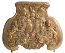A rare 18th Century embossed brass Summer firescreen: chased with two armorial shields within a