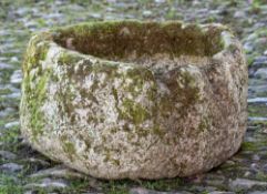 A limestone trough: of irregular triangular form, 51cm (1ft 8in) x 49cm (1ft 7in).