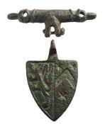 A late Medieval gilt metal horse harness pendant: in the form of a heraldic shield with lion