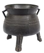 An important and massive 15th Century bronze cauldron: with founder's mark, a saltire cross,