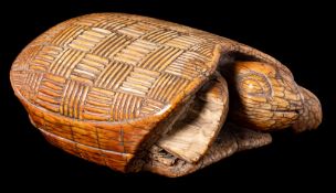 A West African Akan Ashanti ceremonial ivory turtle: the shell carved with a cross-hatched 'Kente'