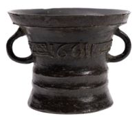 A mid 17th Century mortar: with two loop handles and cast floral band,