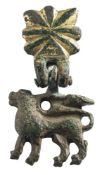 A late Medieval gilt metal horse harness pendant: lion passant on gilt sunburst hanger.