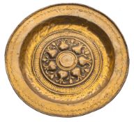 A 16th/early 17th Century Nuremburg brass alms dish: with embossed decoration depicting a ring of